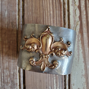 Sterling silver cuff bracelet with brass fleur de lis